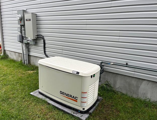 Generac standby generator installed beside a home with transfer switch