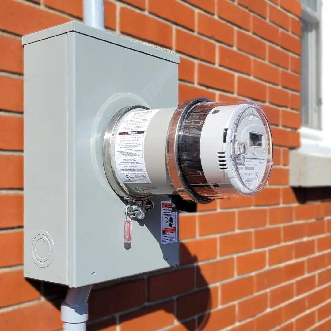 New meter base and metering equipment installed on a brick home